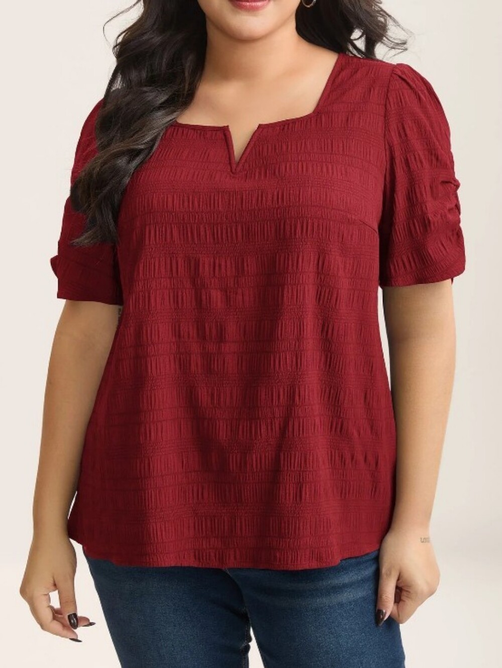 BloomChic red blouse features a notch neckline and gathered puff sleeves.